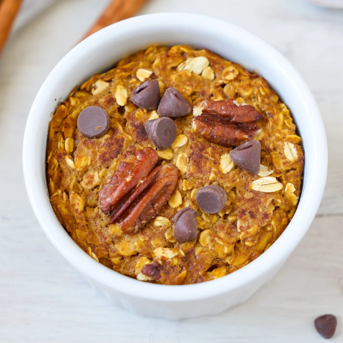 Golden, bubbly Pumpkin Spice Baked Oats freshly baked, perfect for a cozy fall breakfast treat.