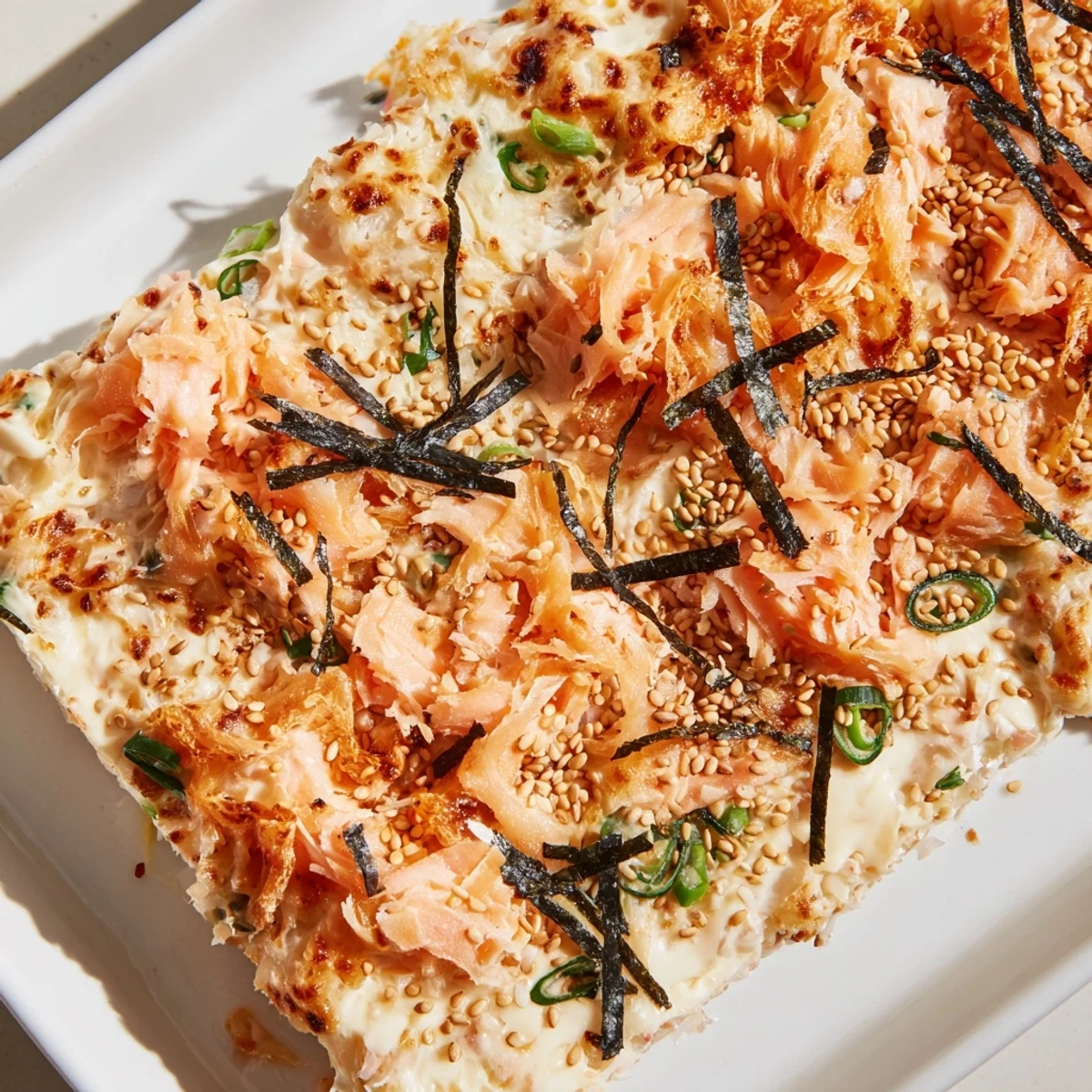 Golden baked Creamy Salmon Sushi Bake, a deconstructed sushi dish filled with tender salmon.