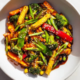 A steaming skillet displaying the colorful, healthy Colorful Vegetable Stir-Fry made with frozen vegetables.