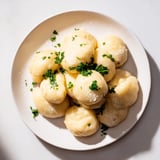 Classic German potato dumplings, perfectly cooked and waiting to be enjoyed with roasted meats.