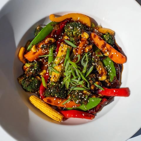 Vibrant Colorful Vegetable Stir-Fry with Budget-Friendly Frozen Vegetables, ready to enjoy with a bowl of rice.