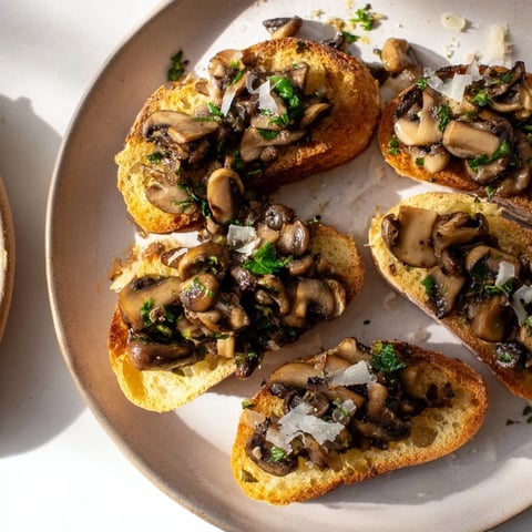 Crispy, golden bruschetta with roasted bread, savory mushrooms, and fresh herbs, ready to serve.
