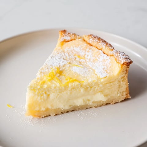 A slice of creamy German cheesecake sits ready to enjoy, a perfect dessert.