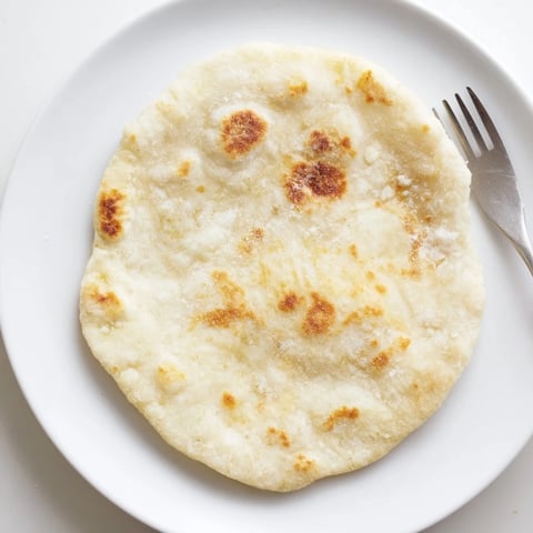 Warm, golden cottage cheese flatbread, perfect for dipping, freshly pan-fried and ready to enjoy.