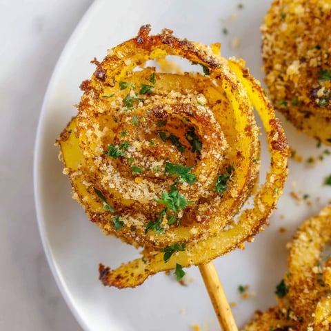 Crispy golden Tornado Potatoes, perfectly seasoned, ready to enjoy as a flavorful snack or side dish.