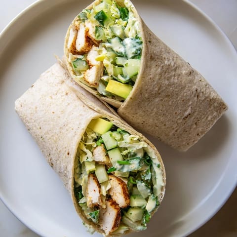 Fresh Green Goddess Chicken Wraps, vibrant with herbs and a creamy dressing, ready to eat.