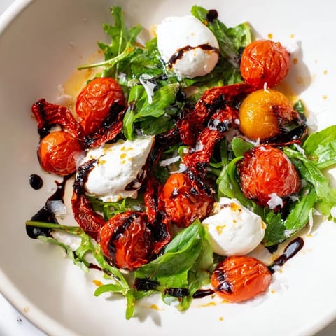 This colorful Tomato Flight Salad features burrata, basil, and a delicious balsamic dressing.
