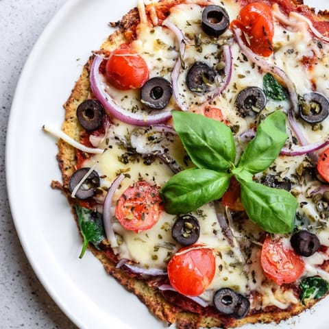 A close-up of a delicious Crispy Tortilla Pizza, showcasing the crispy base and flavorful ingredients.