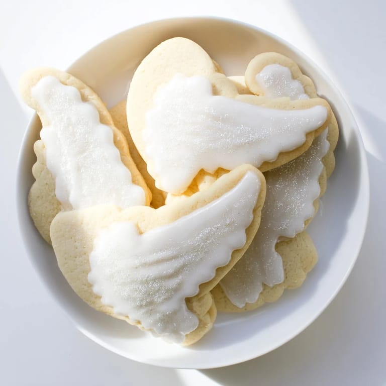 Buttery, freshly baked angel wings sugar cookies, beautifully decorated and ready to enjoy.