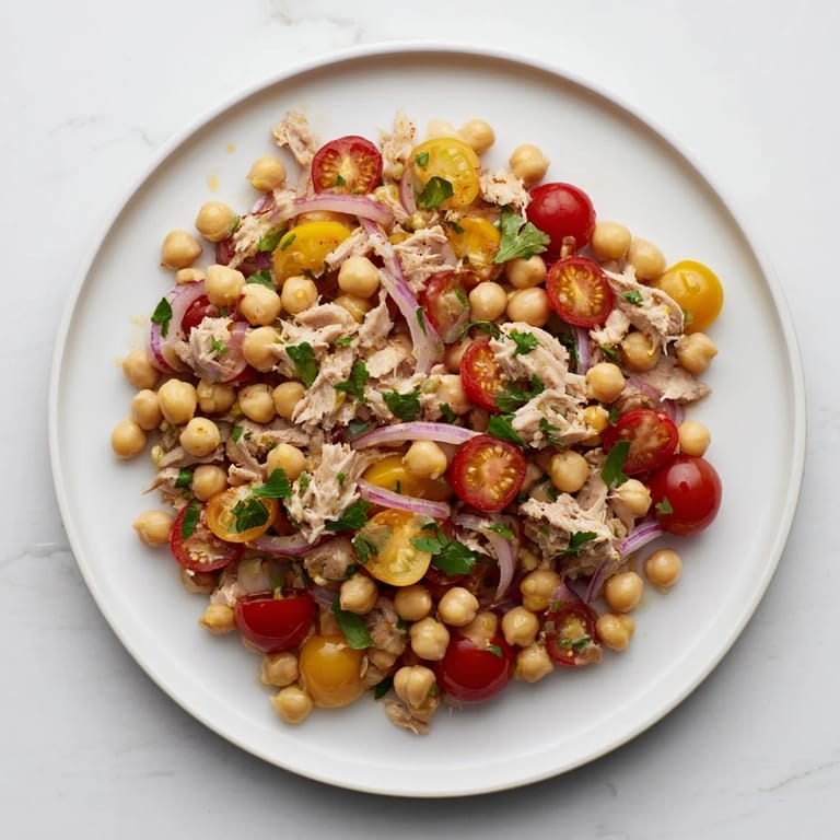 Flaky tuna and chickpeas in the vibrant Dense Chickpea and Tuna Salad, a Mediterranean delight.